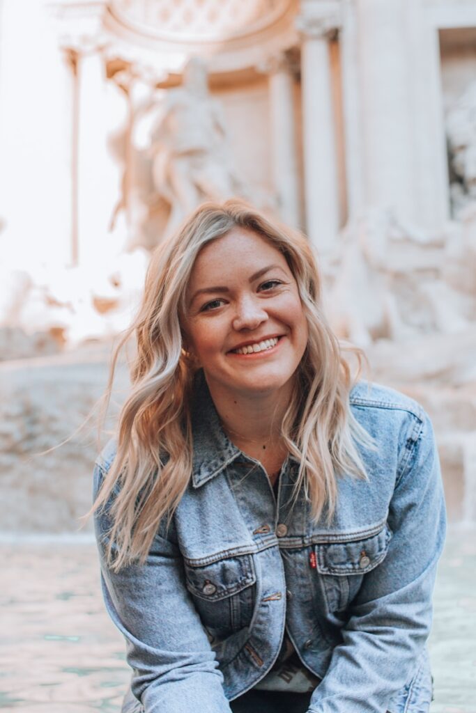 woman smiling wearing denim jacket